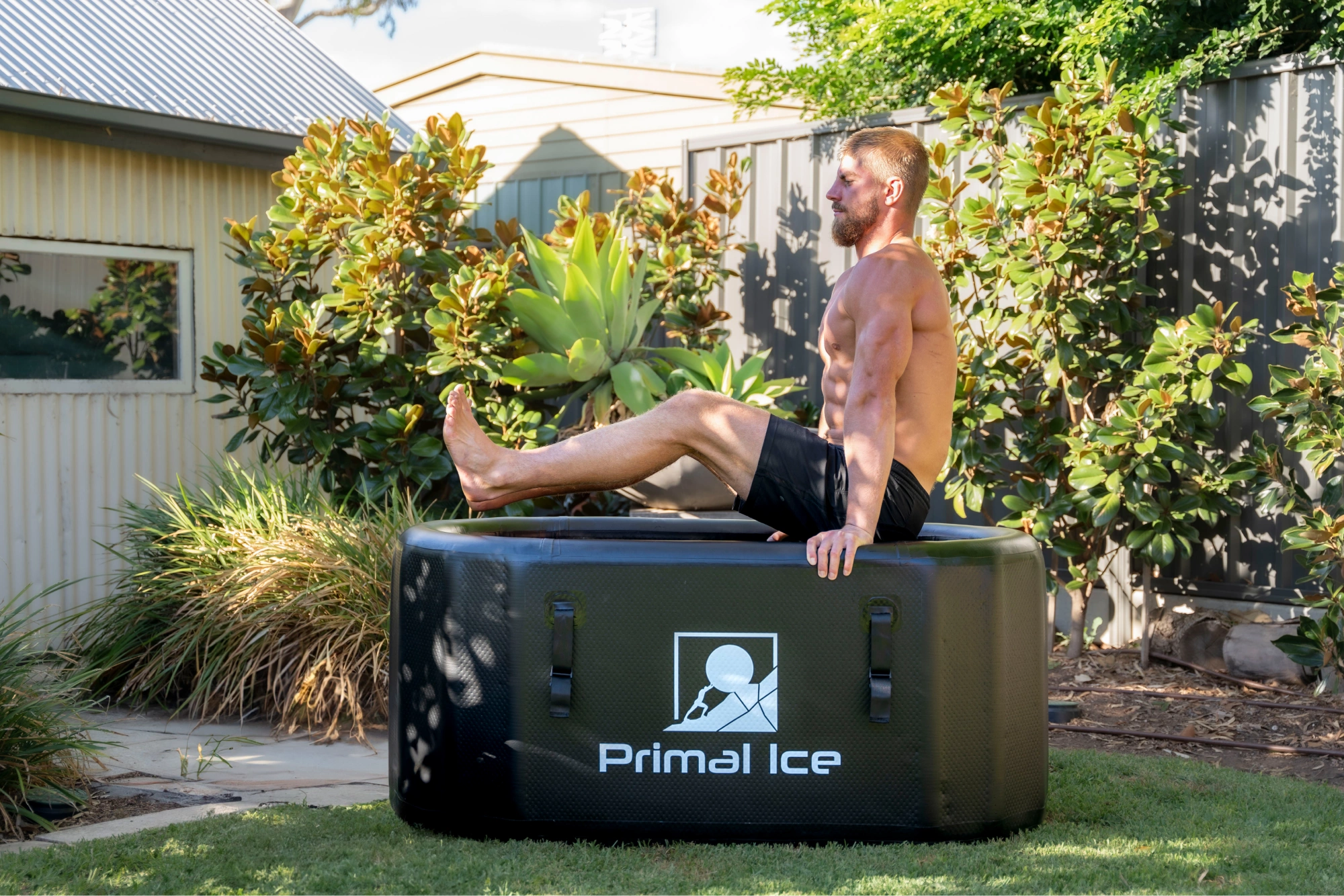 Athletic man entering Primal Ice Bath tub in Australian backyard - better alternative to Vital Plus ice bath