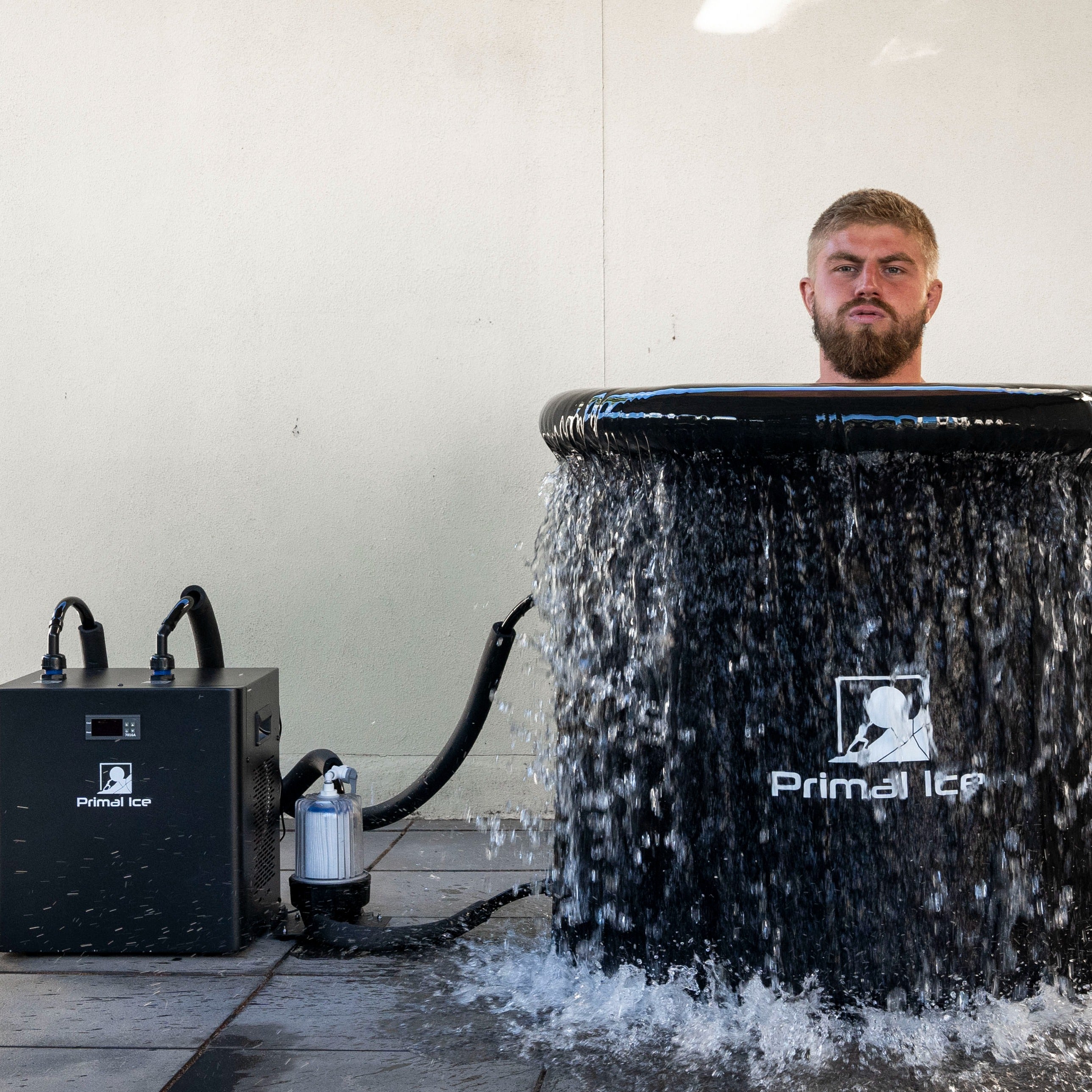 man plunging into ice bath